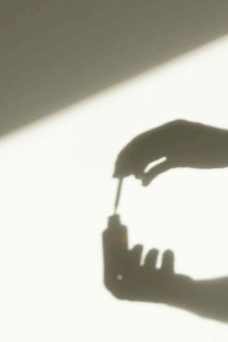 Soft shadow of nail polish being applied